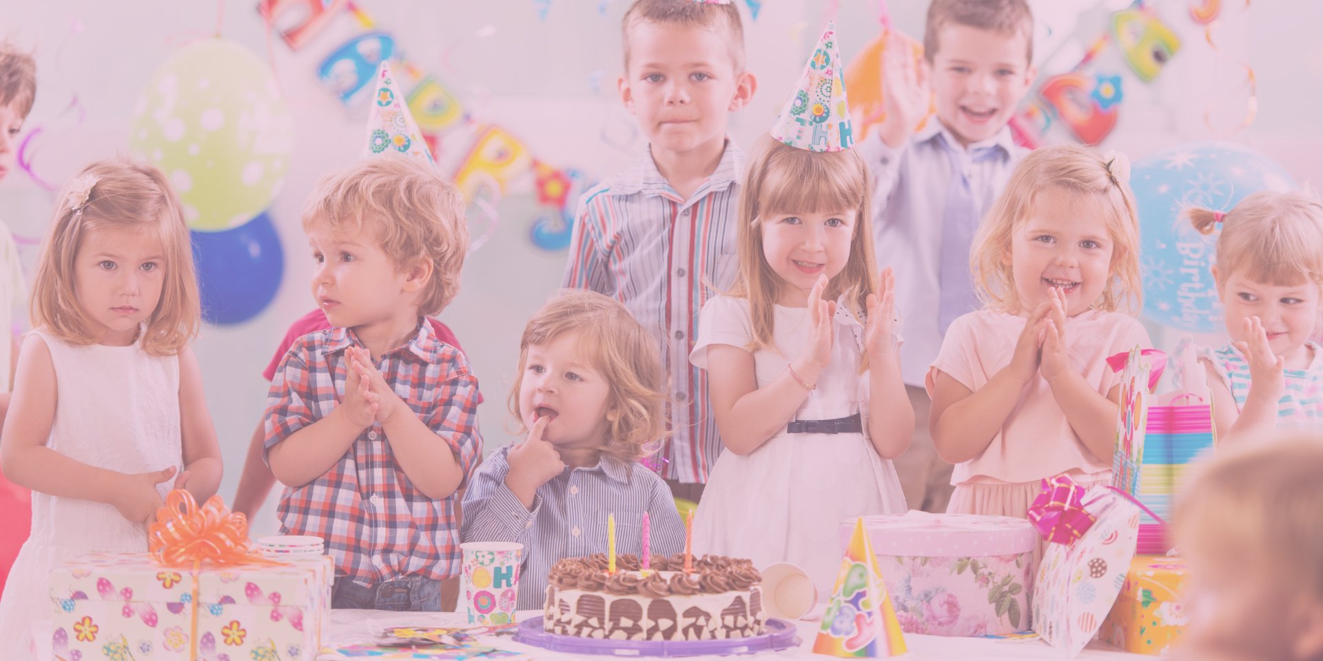 Colorful birthday party setup with children celebrating in a private playroom, featuring party decorations and a cake at Playtime Waco