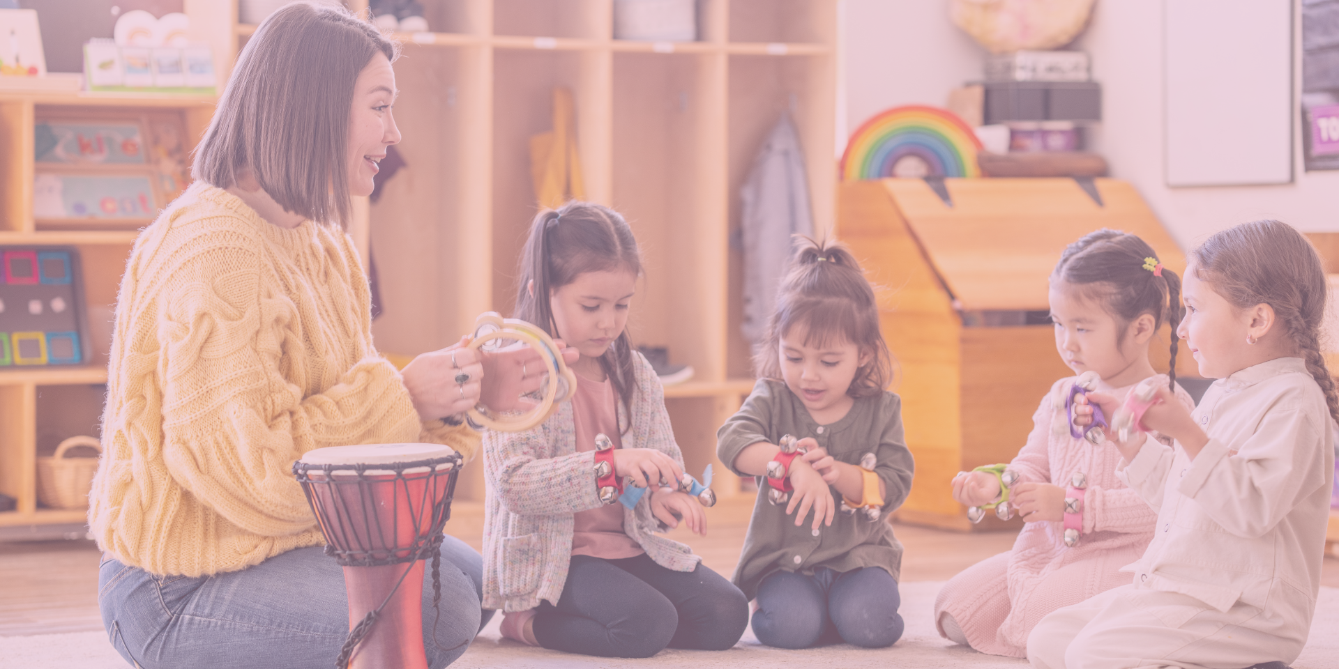 oddlers and babies enjoying an interactive music class with instruments, singing, and movement activities at Playtime Waco